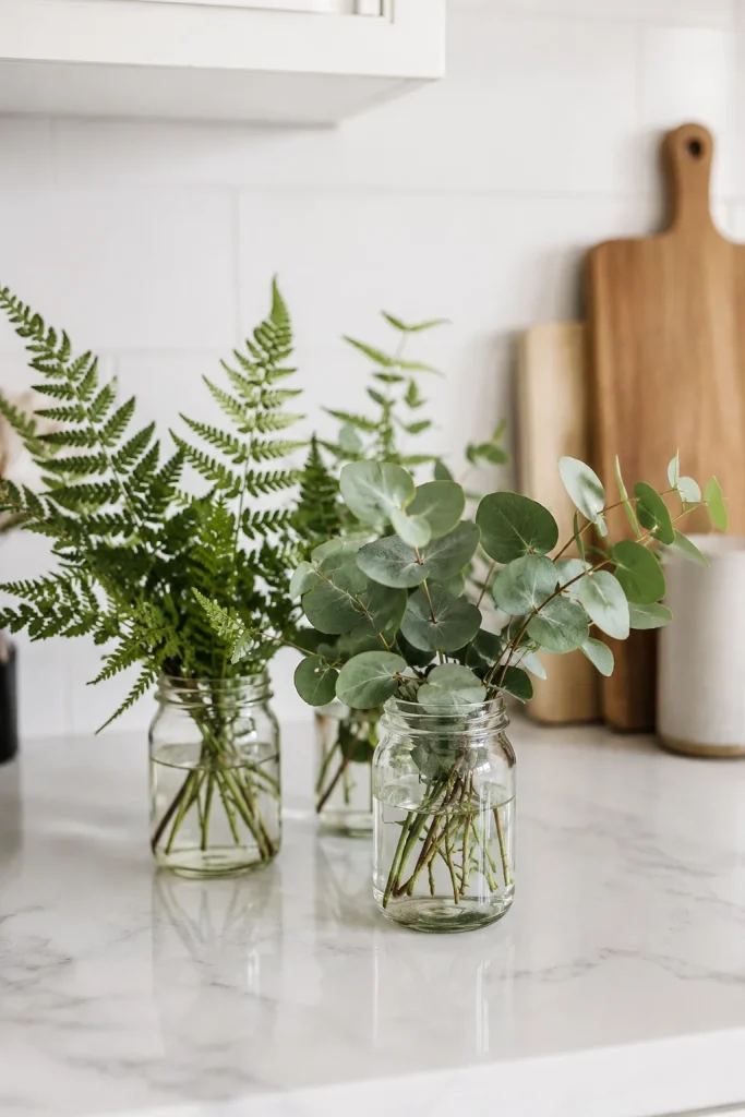 27 Spring Home Decor Ideas to Refresh Your Space in Style 6 Display Fresh Greenery in Glass Jars
